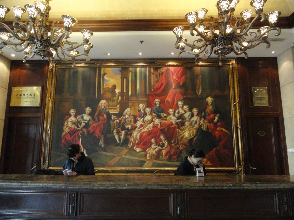 front desk of Tehall Hotel showing large oil painting 